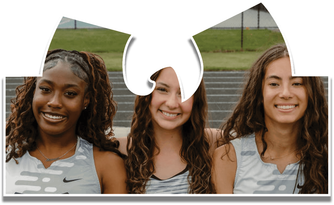 Three girls wearing gray and black shirts. Description generated by AI