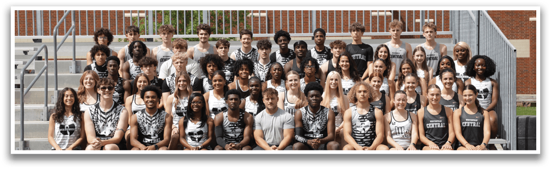 A group of people sitting on a bench. Description generated by AI
