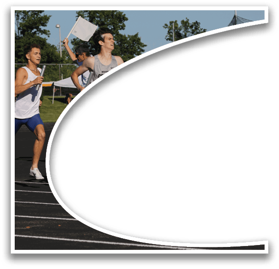 A runner in a blue shirt and black shorts is running on a track. Description generated by AI