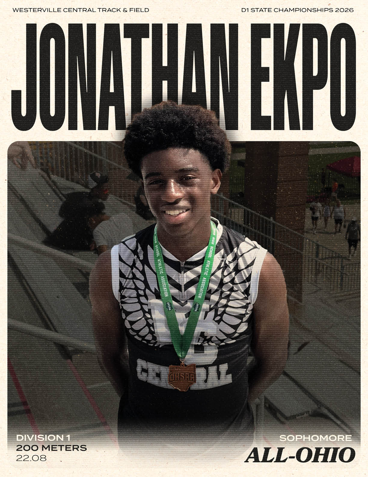 A young man wearing a black shirt with a gold medal around his neck. Description generated by AI