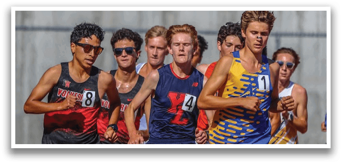 A group of men running on a track. Description generated by AI