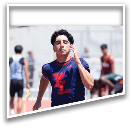 A man running on a track. Description generated by AI