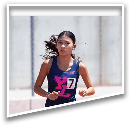 A woman running on a track with the number 71 on her shirt. Description generated by AI