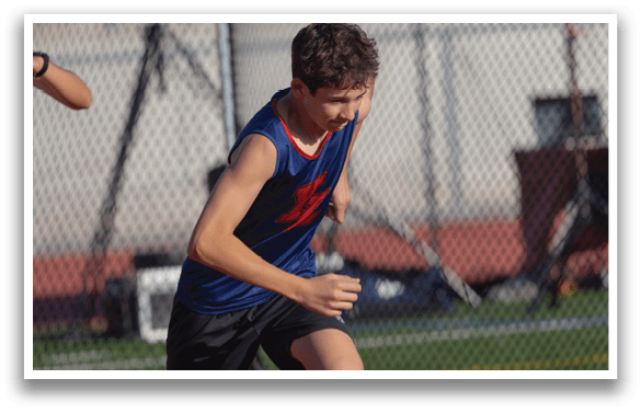 A boy running on a track with a camera in the background. AI generated content