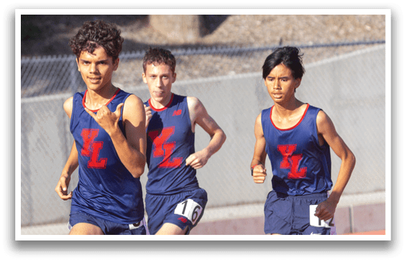 Three young boys running on a track. AI generated content