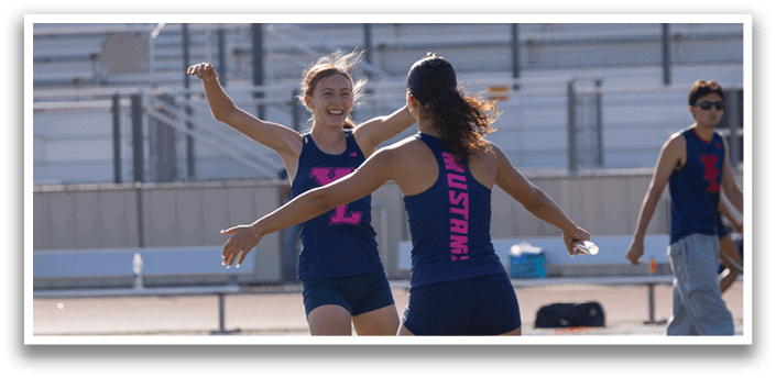 A group of young women are playing frisbee on a field. AI generated content