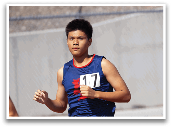 A man wearing a blue shirt and shorts is running on a track. AI generated content