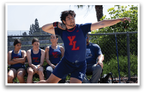 A man in a blue shirt and shorts is throwing a disc. AI generated content