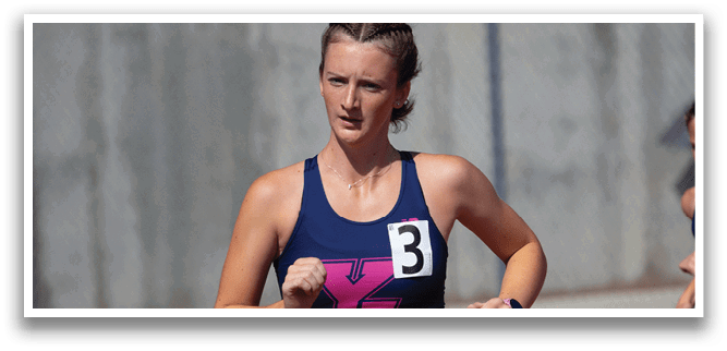 A woman wearing a blue and pink tank top is running on a track. AI generated content