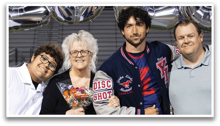 A group of people posing for a photo in front of a banner that says 2026. AI generated content