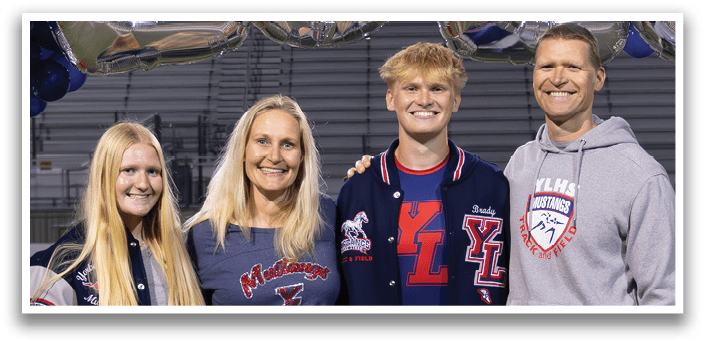 Three people pose for a photo in front of a banner that reads “2026." AI generated content