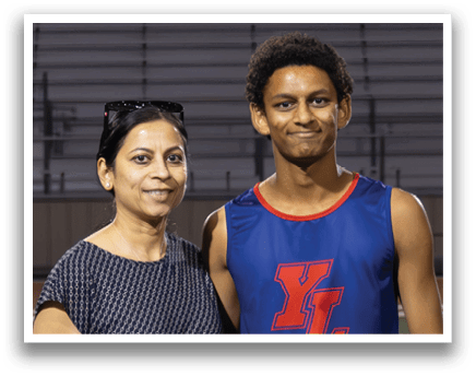 A man and woman stand in front of a banner that reads “2026". AI generated content