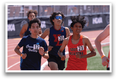 A group of runners on a track. Description generated by AI