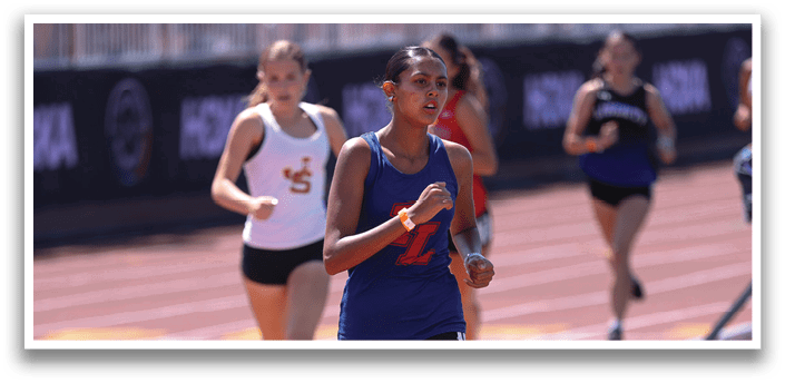 A woman running on a track. Description generated by AI