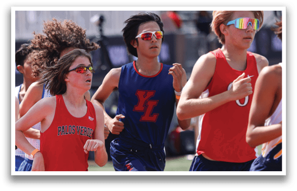 A group of runners on a track. Description generated by AI