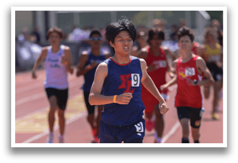 A runner is running on a track. Description generated by AI