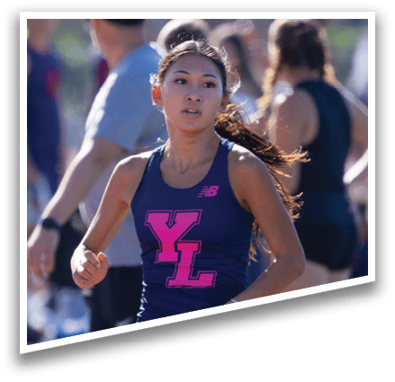 A woman running on a track. Description generated by AI