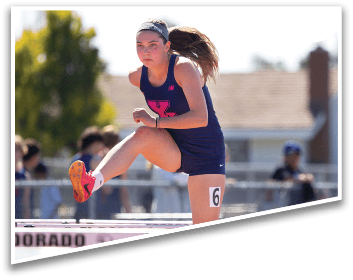 A girl is running on a track. Description generated by AI
