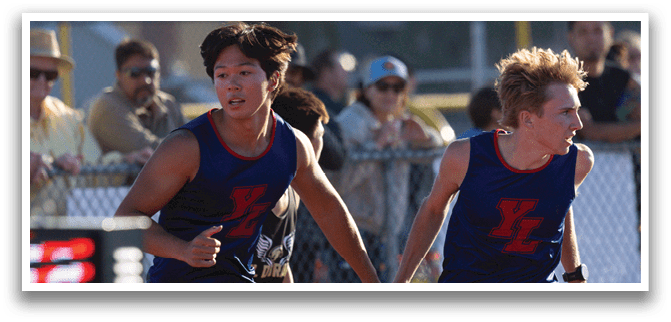 Two men running on a track. Description generated by AI