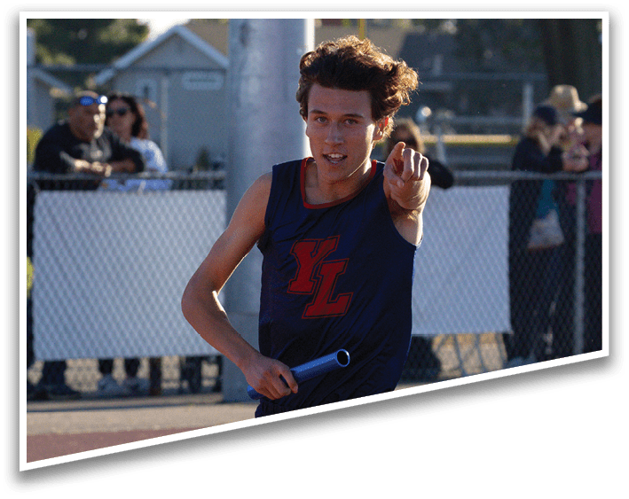 A man running on a track. Description generated by AI