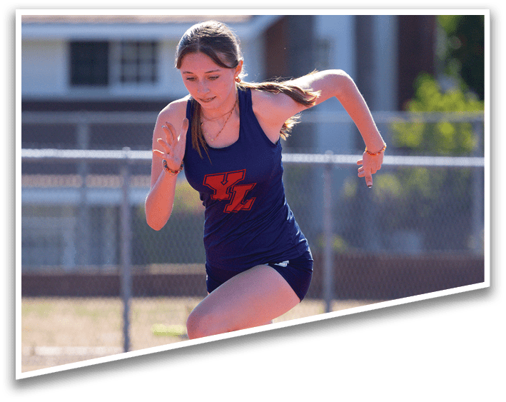 A girl running on a track. Description generated by AI