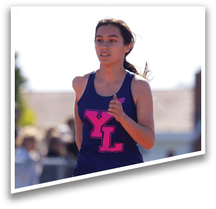 A woman running on a track. Description generated by AI