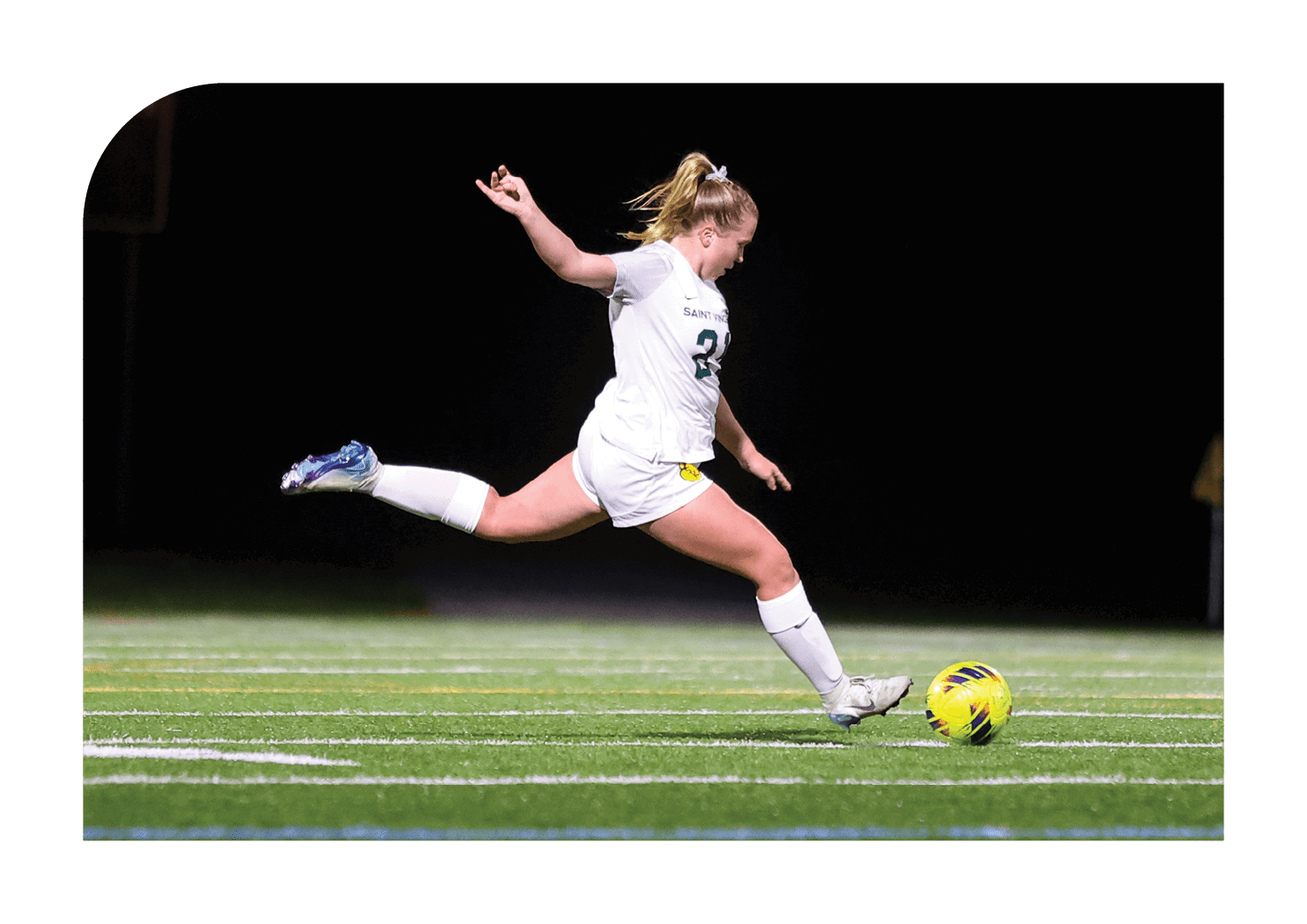 A female soccer player in a white uniform is kicking a soccer ball on a field. AI generated content