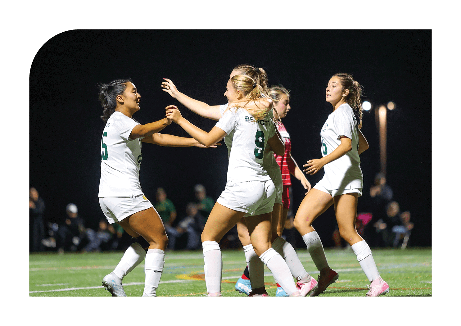 A group of female soccer players celebrating a goal. AI generated content