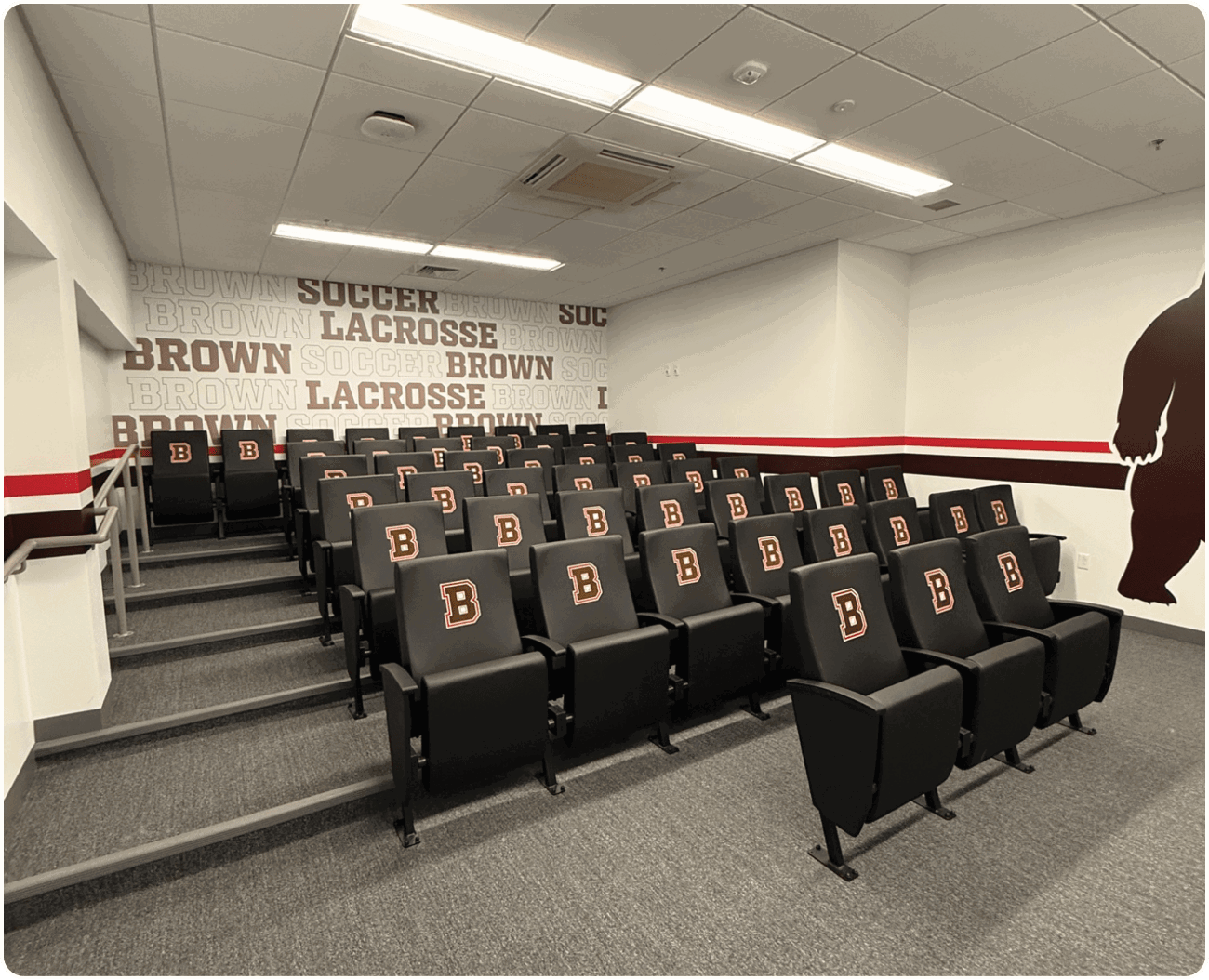 A room with a large number of chairs, some of which are black and have the letters “B" and "E" on them. The chairs are arranged in rows, creating a seating area. AI generated content