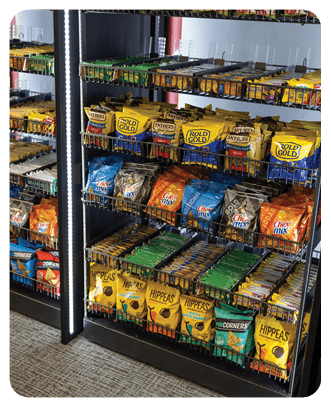 A refrigerator filled with various drinks and snacks. AI generated content