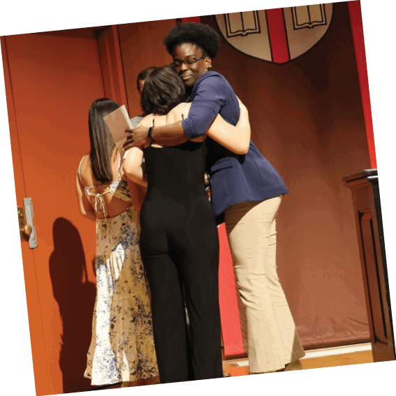 Three people hugging in front of a podium. AI generated content