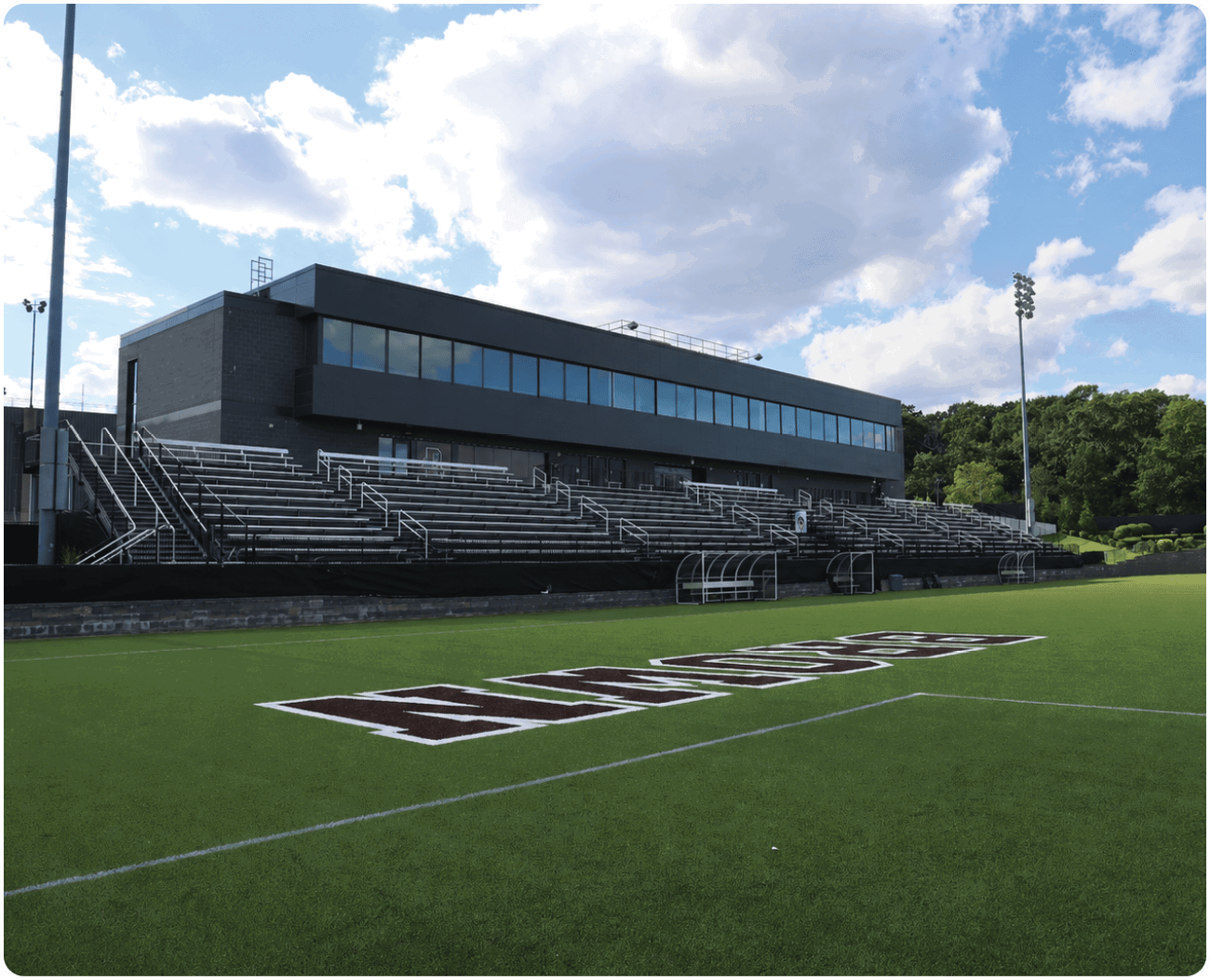 A soccer field with a stadium in the background. AI generated content