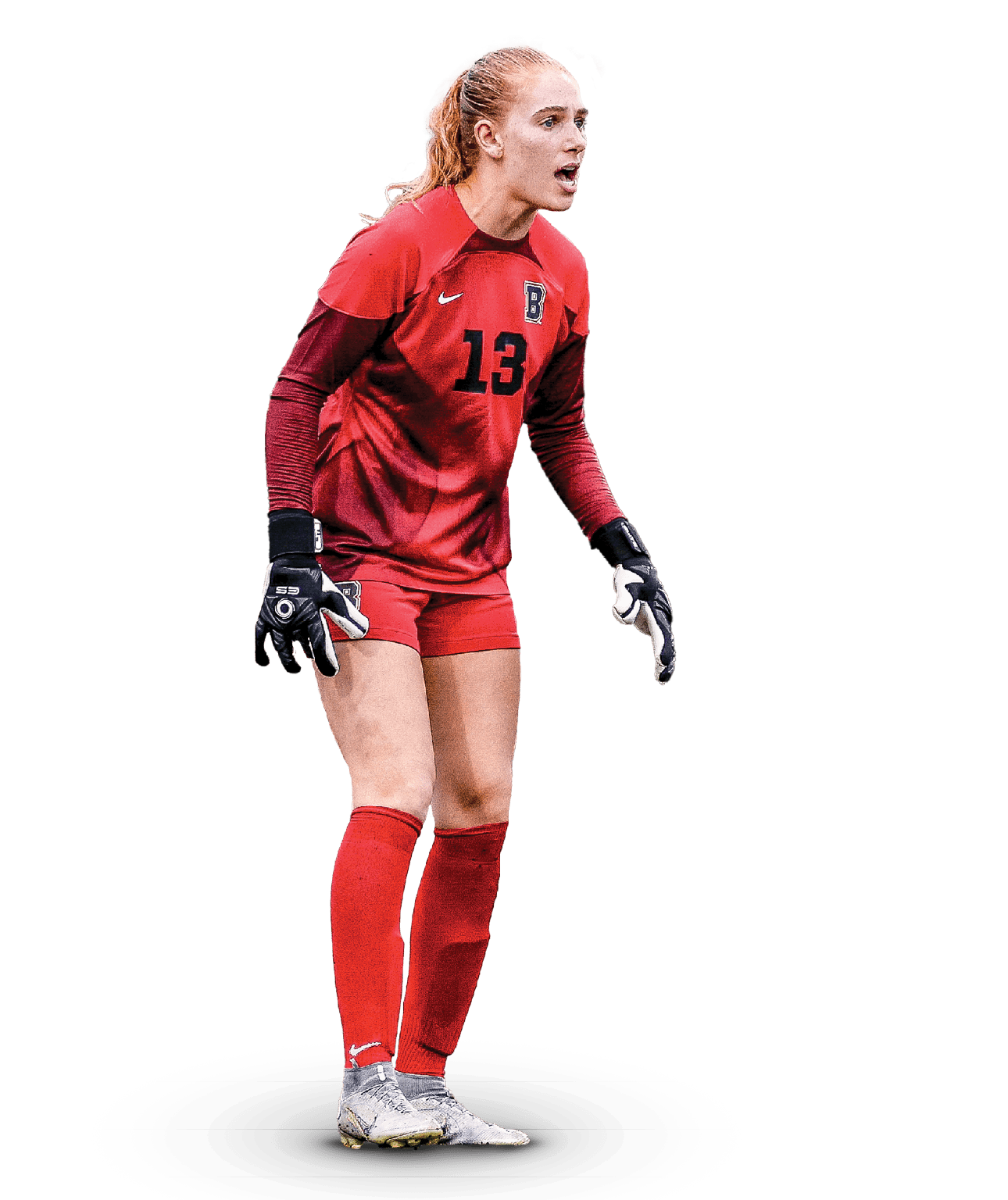 A female soccer player wearing a red and black uniform stands on a white background. AI generated content