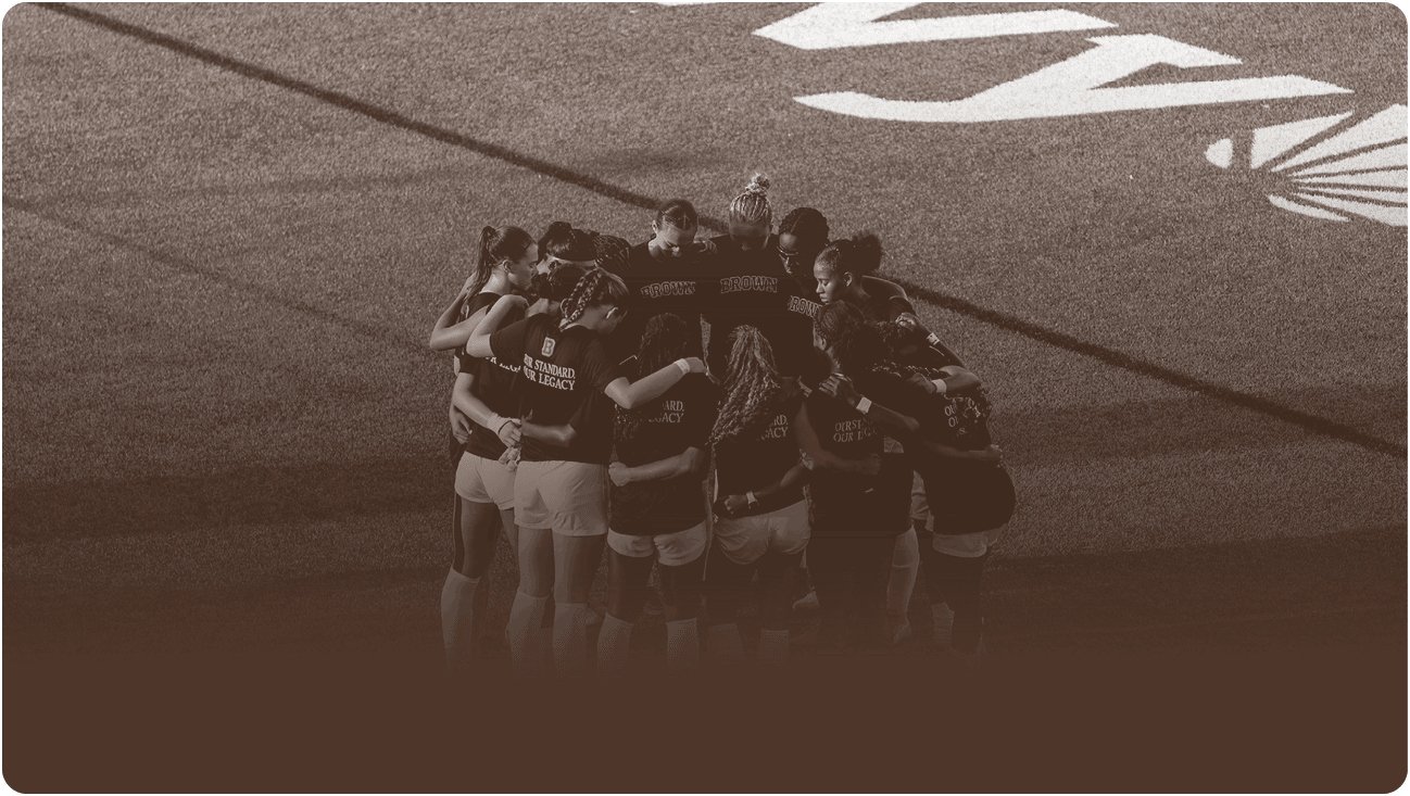 A group of people huddled together on a field, forming a circle. AI generated content