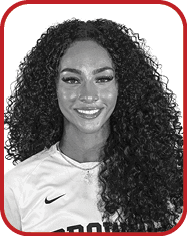 A woman wearing a white and brown jersey with the number 7 on it. AI generated content