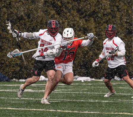 A group of people playing a game of lacrosse. Description generated by AI