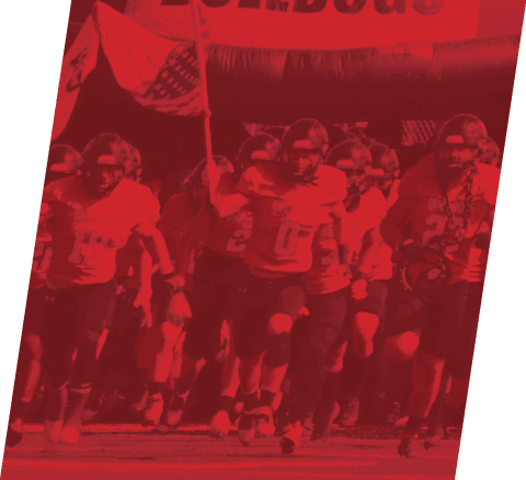 A football player in a red jersey is running with a football in his hand. AI generated content