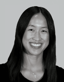 Close-up of a person with long dark hair parted in the middle, showing the forehead and upper part of the eyes. Description generated by AI