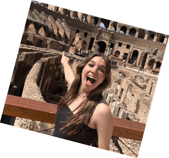A woman is standing on a bridge in front of a building with a large arch. AI generated content