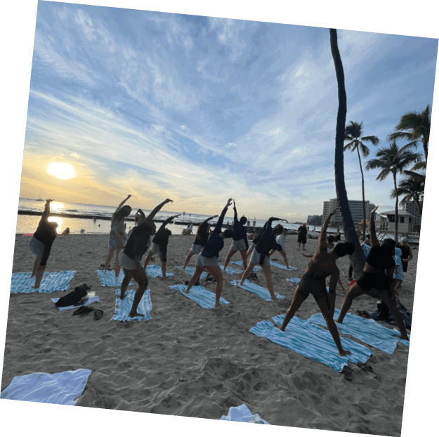 A group of people are practicing yoga on the beach. AI generated content
