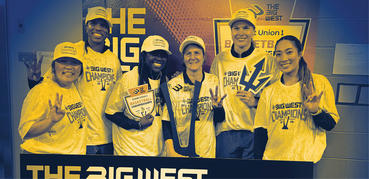 Five people pose for a photo in front of a sign that says “The Biggest Champions." AI generated content