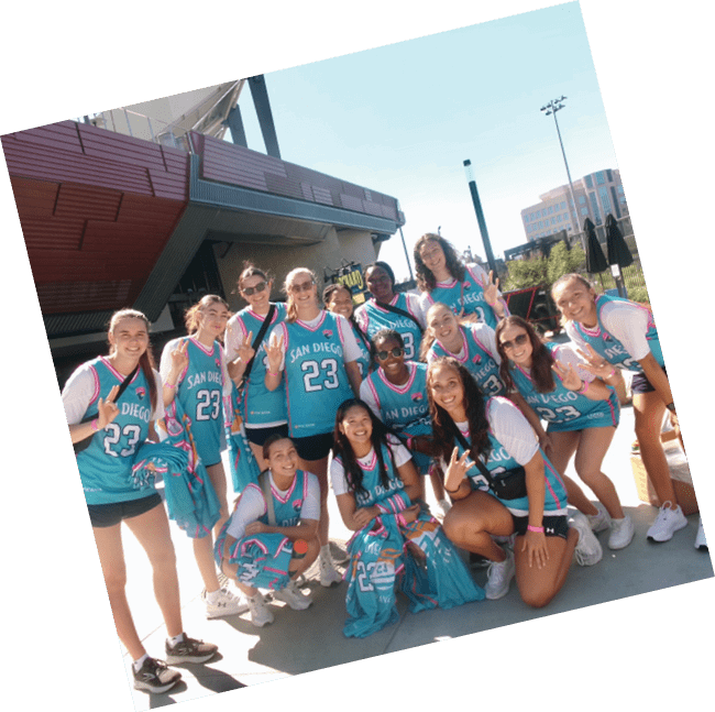 A group of young women wearing blue sports uniforms pose for a picture. AI generated content
