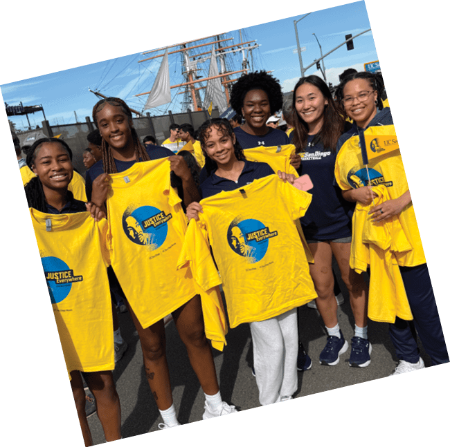 A group of people are holding up yellow shirts with a blue logo. AI generated content